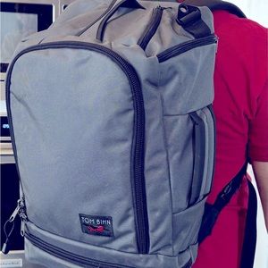 Tom Bihn backpack, grey with maroon interior.